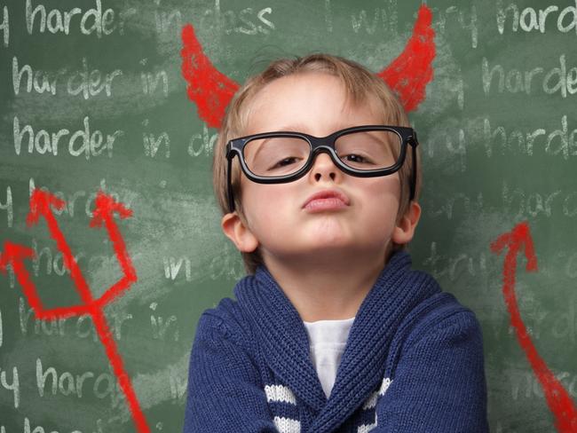 Naughty devil schoolboy with lines written on a blackboard reading I will try harder in class and devils horns, tail and pitchfork. Detention and school discipline / punishment concept