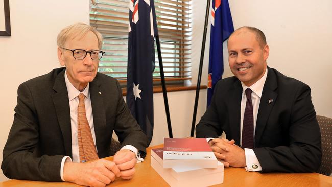 Commissioner Kenneth Hayne and Treasurer Josh Frydenberg with the final report from the banking Royal Commission. Picture: Kym Smith