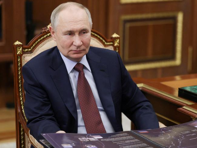 In this pool photograph distributed by the Russian state agency Sputnik, Russia's President Vladimir Putin meets with the Governor of Kamchatka region in Moscow on February 17, 2024.  (Photo by Mikhail METZEL / POOL / AFP)