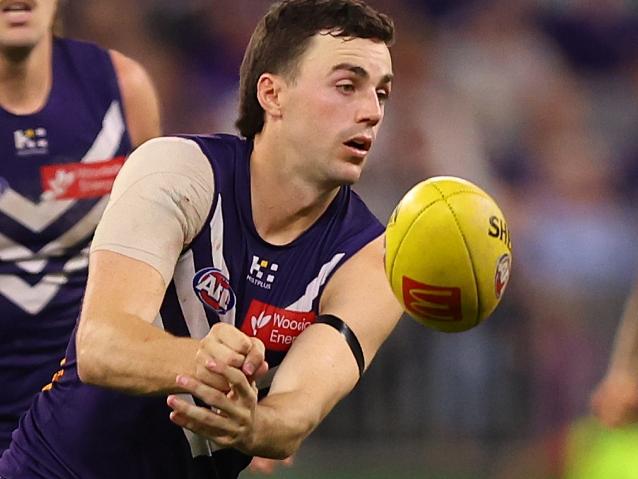 PERTH, AUSTRALIA - MAY 08: Jordan Clark of the Dockers handballs during the round nine AFL match between Fremantle Dockers and Collingwood Magpies at Optus Stadium, on May 08, 2025, in Perth, Australia. (Photo by Paul Kane/Getty Images)