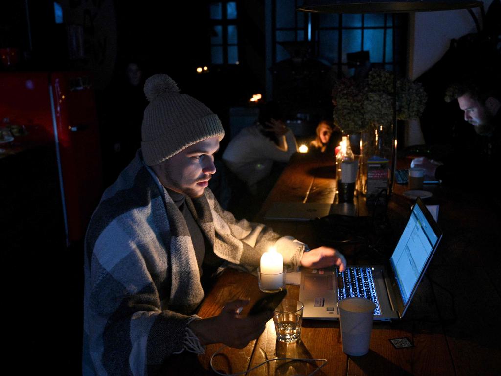 People in a coffee shop in Lviv as the city lives through a power outage. Picture: Yuriy Dyachyshyn/AFP