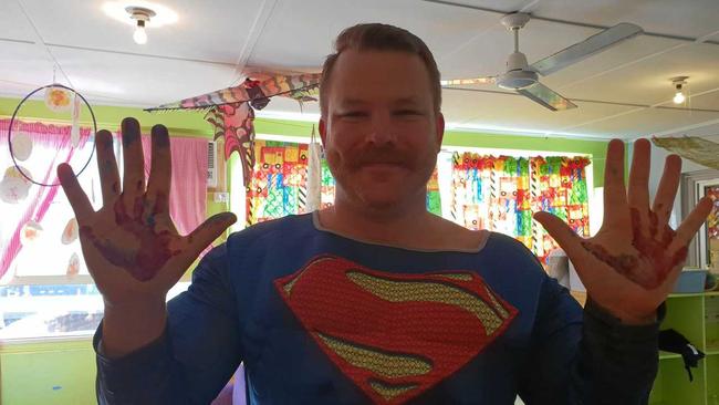 THEIR HERO: "Super Sam" at a fundraiser for HeartKids showing off his impressive moustache. Picture: Sam Stolberg