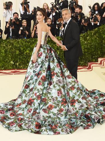 Amal Clooney, wearing Richard Quinn, and George Clooney attend the 2018 Met Gala. Picture: Getty