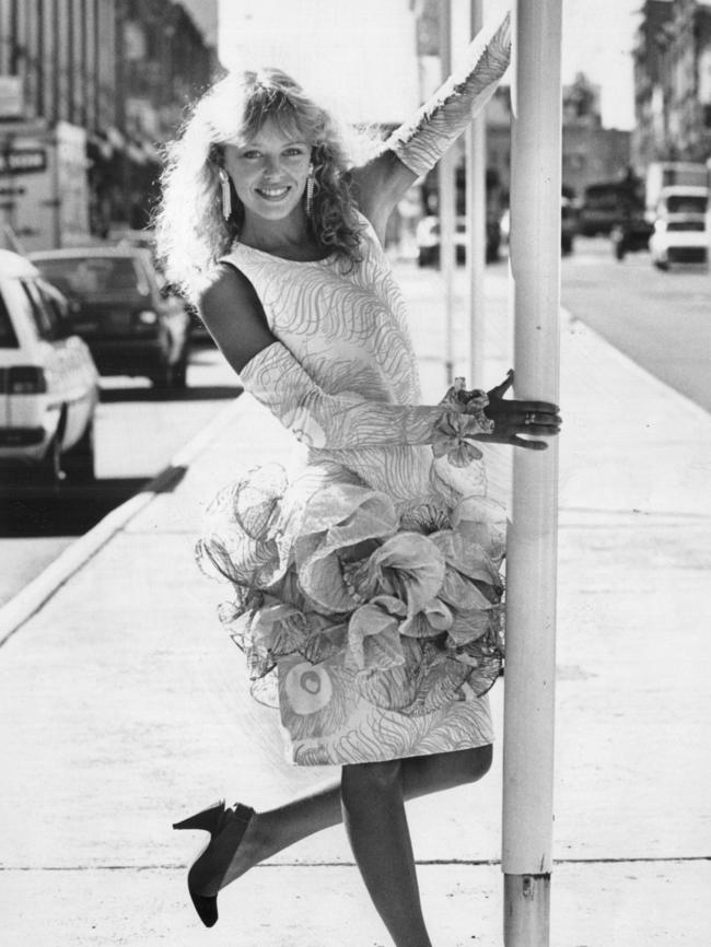 Frizzy perm and cut-out sleeves aka the girl next door. Picture: News Corp Australia