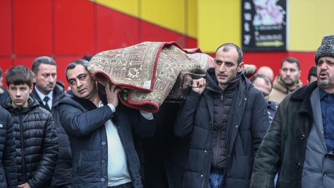 Mourners carry the body of Mahammadali Eganov, 13 who died in the Azerbaijan Airlines Embraer 190 crash near Kazakhstan's Aktau airport, at his funeral on December 28 Picture: Aziz Karimov/Getty Images