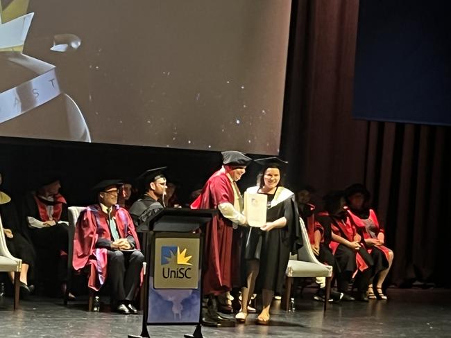 Graduates from the University of the Sunshine Coast's Fraser Coast campus celebrating at the Brolga Theatre.