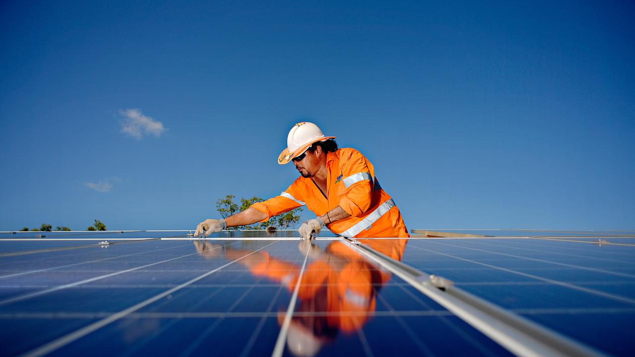 A rigger working on a 3200 panel solar farm in the Northern Territory helps the growth of renewable energy sources that scientists say are key to mitigating climate change.