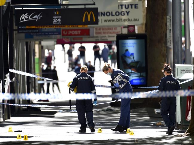 Forensic police piece together the murder scene near the corner of Bourke St and Queen St. Picture: Nicki Connolly