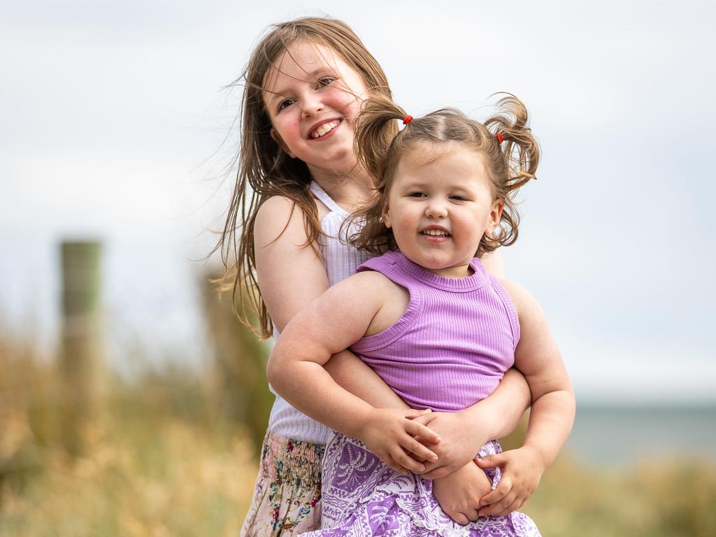 Alessia Corney, 7, with sister Sienna, 2. Picture: Jake Nowakowski