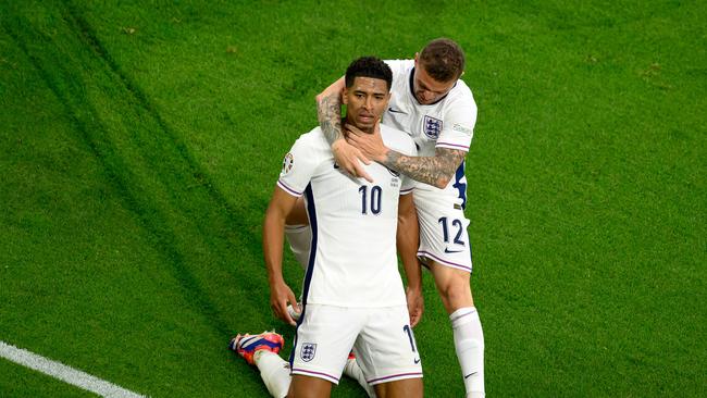 Jude Bellingham of England celebrates scoring his team's first goal with teammate Kieran Trippier during the UEFA EURO 2024 group stage match between Serbia and England. (Photo by Matthias Hangst/Getty Images)