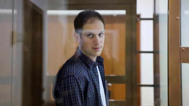 Wall Street Journal reporter Evan Gershkovich stands inside an enclosure for defendants before a court hearing to consider an appeal against his pre-trial detention on espionage charges in Moscow, Russia, October 10, 2023. REUTERS/Evgenia Novozhenina