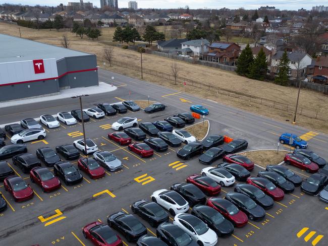 A Tesla dealership in Canada has become the latest flashpoint in a growing backlash against Elon Musk’s expanding influence. (Photo by Katherine KY Cheng / GETTY IMAGES NORTH AMERICA / Getty Images via AFP)