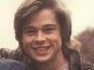 A 21 year old Brad Pitt (right) grins at the camera as he poses next to two of 'The Dark Side of the Sun' producers. Picture: Luaren Lloyd / Supplied