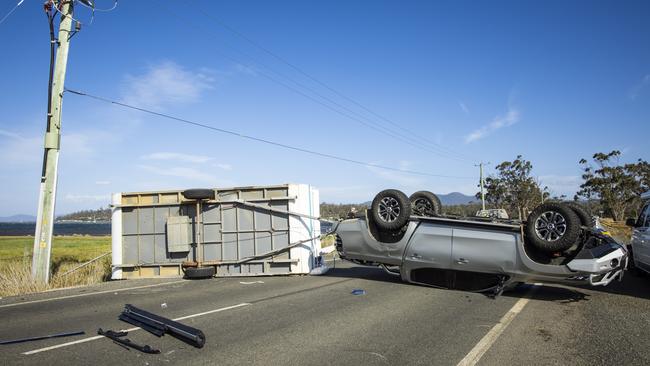 The ute and caravan that were blown over on the Tasman Highway near Triabunna. Picture: PAUL HOELEN PHOTOGRAPHY