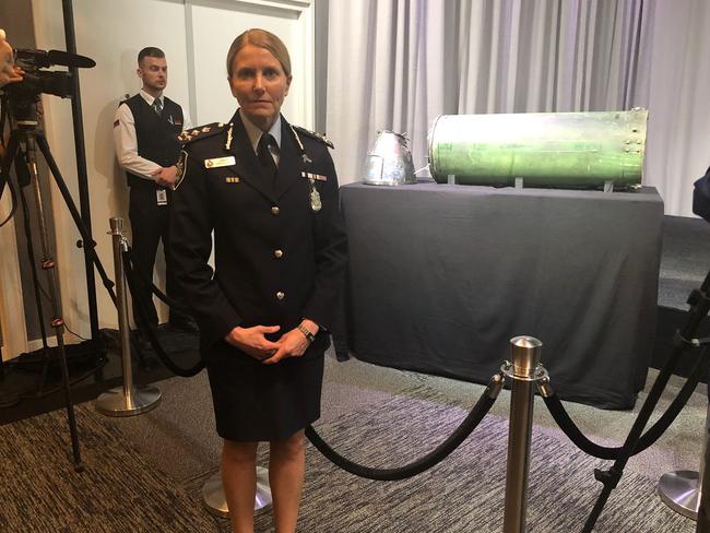 Australian Federal Police commander Jennifer Hurst with the Russian missile.