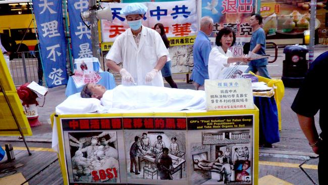 Falun Gong protesters simulate a prisoner organ-harvesting in Hong Kong. Picture: Cory Doctorow/Flickr