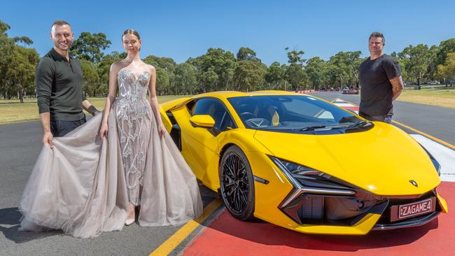 Paul Vasileff and model Talulla, and chef Scott Huggins, with the Lamborghini Revuelto, ahead of the Adelaide Motorsport Festival. Picture: Ben Clark