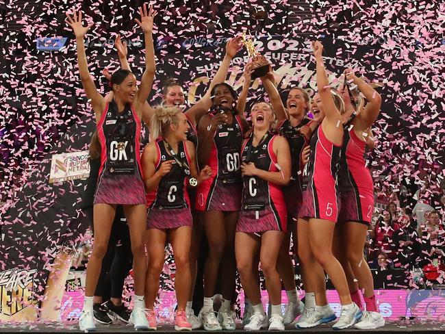 MELBOURNE, AUSTRALIA - JULY 08: Players of the Thunderbirds celebrate victory with the trophy on stage after the 2023 Super Netball Grand Final match between Adelaide Thunderbirds and NSW Swifts at John Cain Arena on July 08, 2023 in Melbourne, Australia. (Photo by Kelly Defina/Getty Images)