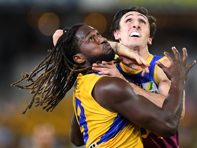 West Coast’s Nic Naitanui (left) battles with Brisbane’s Oscar McInerney. Picture: Albert Perez/Getty Images