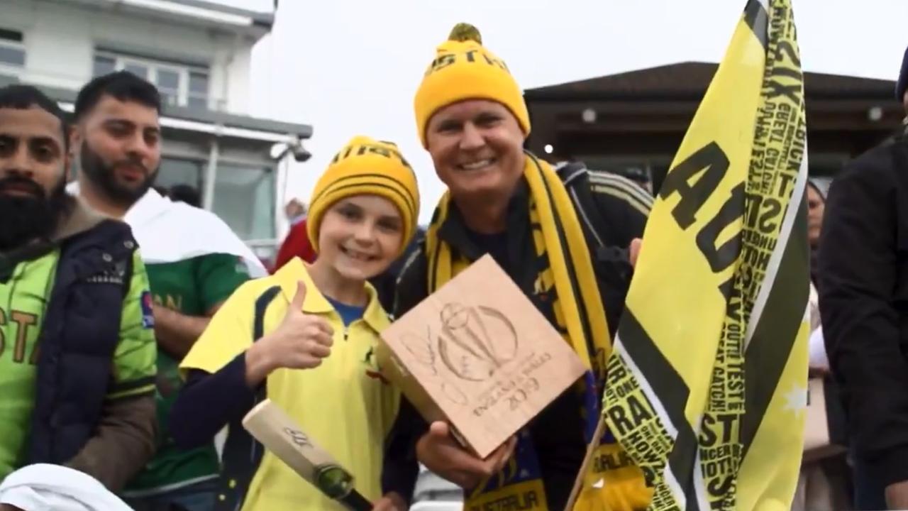 A young fan gives the thumbs up after receiving the award.