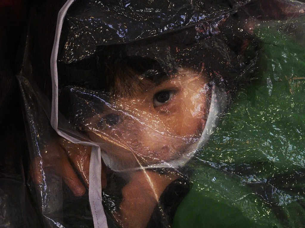 This child is safe inside a giant clear shopping bag. Picture: Weibo