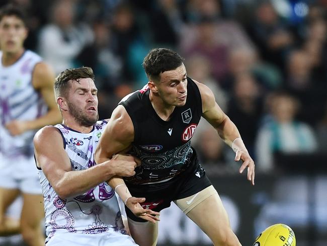 ADELAIDE, AUSTRALIA - MAY 30: Orazio Fantasia of Port Adelaide tackled by Luke Ryan of the Dockers during the round 11 AFL match between the Port Adelaide Power and the Fremantle Dockers at Adelaide Oval on May 30, 2021 in Adelaide, Australia. (Photo by Mark Brake/Getty Images)