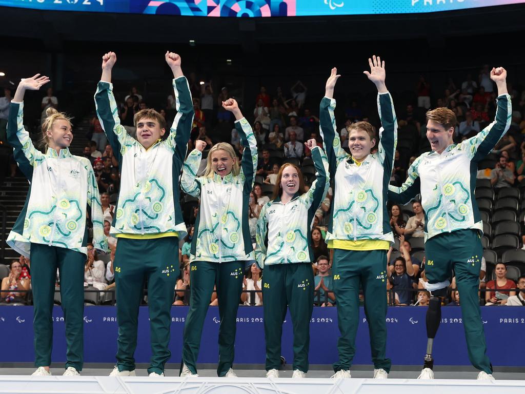 Gold medallist Jesse Aungles, Timothy Hodge, Emily Beecroft, Alexa Leary, Callum Simpson, Keira Stephens of Team Australia pose during the medal ceremony of the Mixed 4x100m Medley Relay - 34 Points on day five of the Paris 2024 Summer Paralympic Games at Paris La Defense Arena on September 02, 2024 in Nanterre, France. Picture: Sean M. Haffey/Getty Images