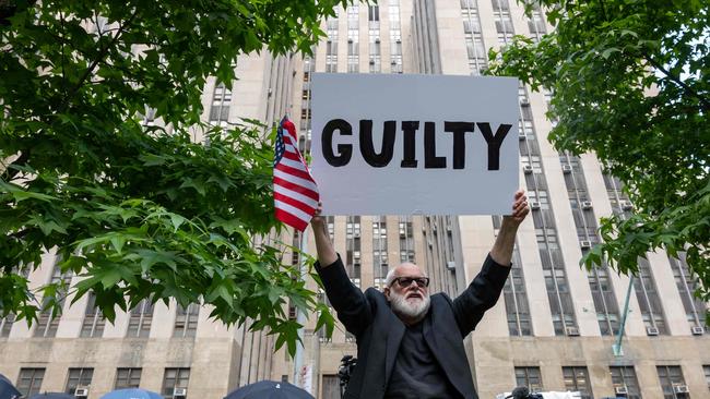 Anti-Trump protestors celebrate after he was was found guilty on all counts at Manhattan Criminal Court on May 30, 2024 in New York City.