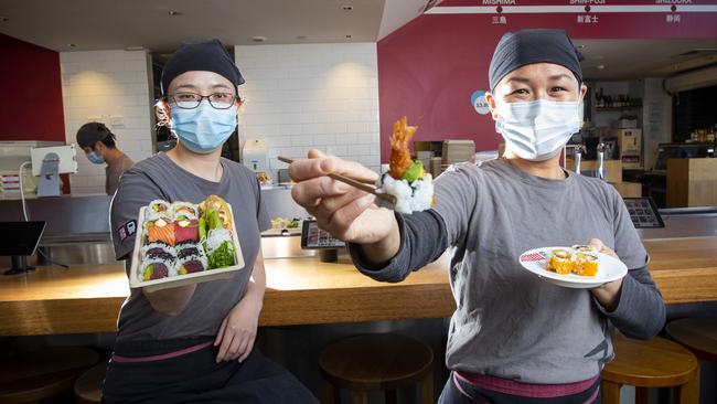 Staff members Cassie Li, left and Hitomi Lillecrapp at Japanese restaurant Sush on Hobart's waterfront, which will open up to diners from Monday. Picture: LUKE BOWDEN