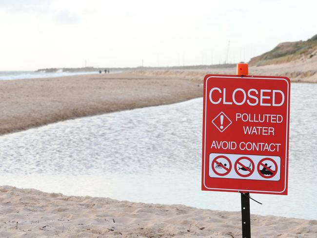 A 400 metre section of Christies Beach has been temporarily closed to swimmers and fishers as a precaution. Picture: Stephen Laffer