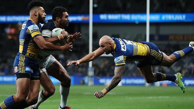 Cowboys Justin O'Neill is tackled by Parramatta's Waqa Blake and Blake Ferguson who both provide good value for money for the Eels, according to the Rich 100. Picture: Brett Costello