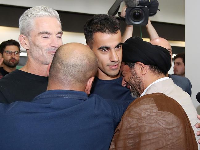 Hakeem al-Araibi is hugged upon his arrival at Melbourne Airport. Picture: Getty