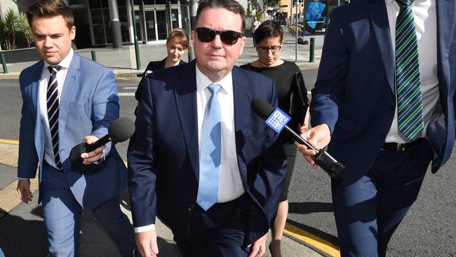 Former Logan mayor Luke Smith (centre) leaving Brisbane Magistrates Court on May 14, 2019. Picture: AAP Image/Darren England