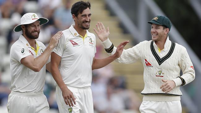 Left-arm paceman Mitchell Starc is congratulated after taking a wicket in the tour match against Worcestershire. Picture: Getty Images