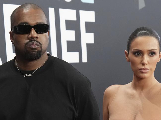 EDS NOTE: NUDITY - Kanye West, left, and Bianca Censori arrive at the 67th annual Grammy Awards on Sunday, Feb. 2, 2025, in Los Angeles. (Photo by Jordan Strauss/Invision/AP)