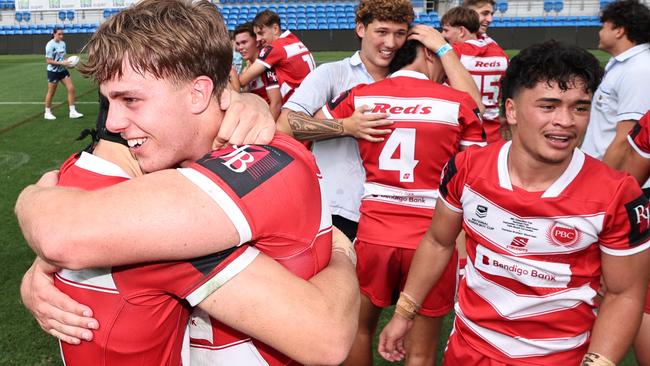 NRL National Schoolboys Cup final at CBUS Stadium  between Palm Beach Currumbin and Patrician Blacktown Brothers. The Red Army and Palm Beach Currumbin players celebrate the win.  .Picture Glenn Hampson