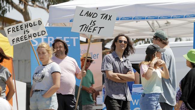 A land tax protester at a Liberal Party stall in 2018. Picture: RICHARD JUPE