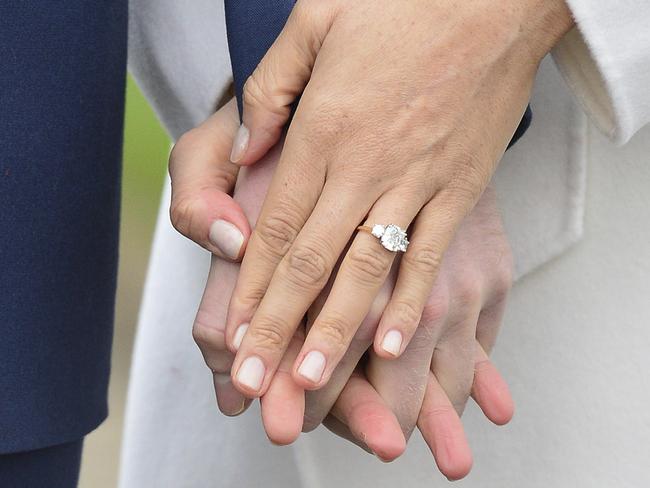 Meghan Markle’s engagement ring includes a trio of diamonds. Picture: Dominic Lipinski/PA via AP