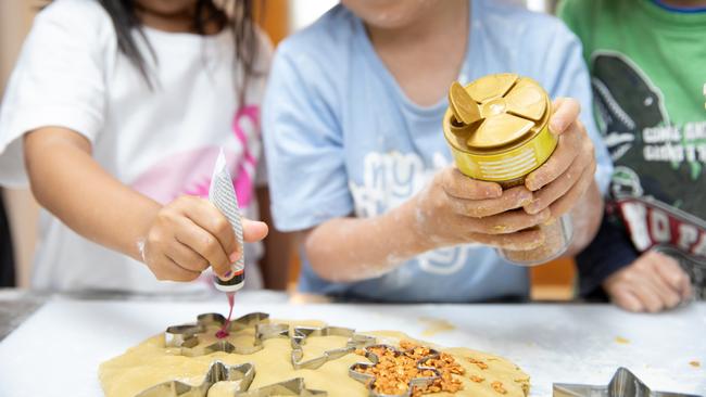 Decorating gingerbread men. Picture: Dominika Lis