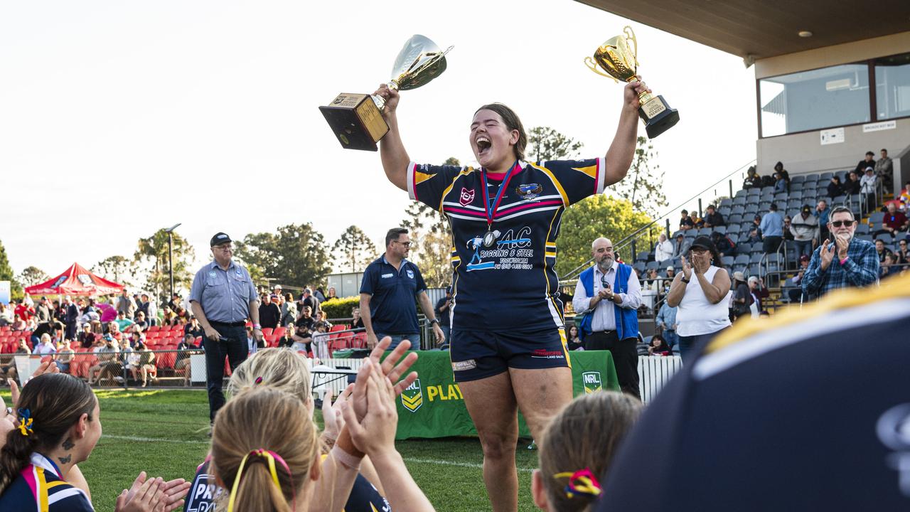 Highfields captain Katelyn Collie lifts the TRL women’s premiership trophies. Picture: Kevin Farmer