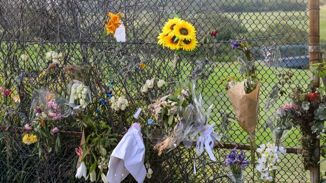 Flowers and notes placed near the beach access at Little Bay. Picture: Nicholas Eagar