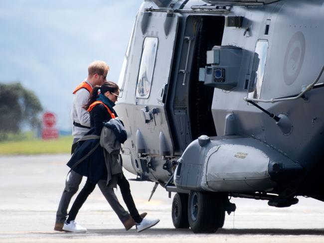 Britan's Prince Harry and his wife Meghan, the Duchess of Sussex, arrive at the military terminal to board an Air Force NH90 helicopter that took them to Tasman in Wellington. Picture: AFP