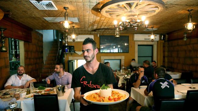 Elie Jabarian serves diners at Middle Eastern Lebanese restaurant, Gebran in Mt Lewis. Picture: Carmela Roche.