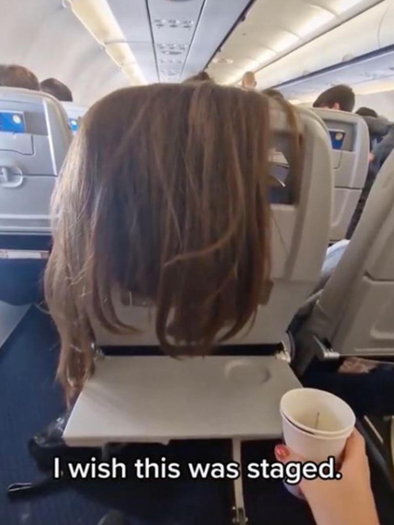 The passenger’s hair was all over the back of her seat, spilling onto her tray.