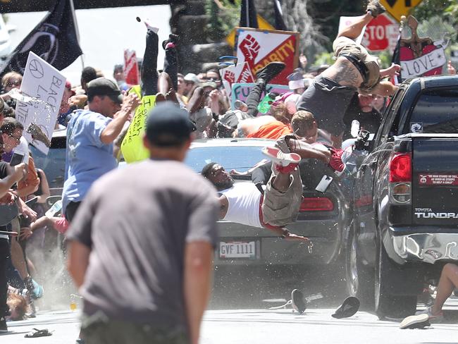 People are thrown into the air as a car plows into a group of protesters demonstrating against the Unite the Right rally in Charlottesville, Virginia, on Aug. 12, 2017. The attack killed Heather Heyer and injured 19 others. James Alex Fields Jr., the alleged driver, was charged with second-degree murder. Picture: Ryan M. Kelly/The Daily Progress/World Press Photo