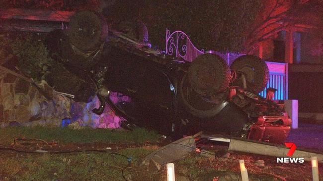 A 20-year-old driver has been taken to hospital after his ute flipped on its roof after crashing into a Stobie pole at Torrens Park. . Picture: 7NEWS