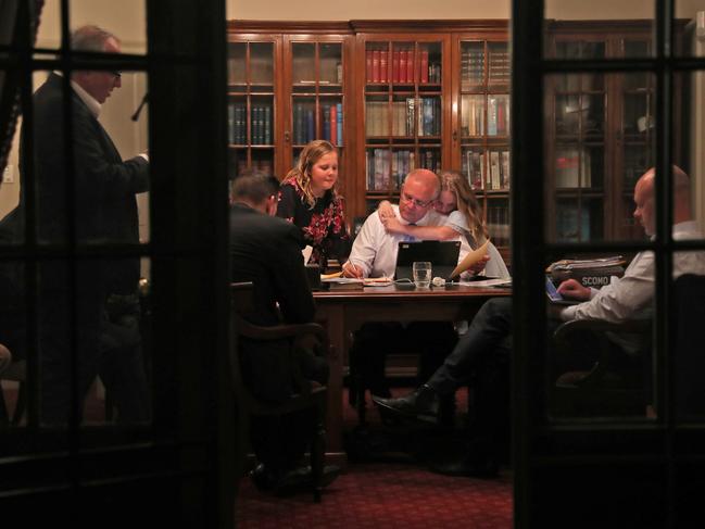 Scott Morrison in his office soon before leaving Kirribilli House, Sydney to declare victory in the federal election. With daughters Lily and Abbey and from left: Senior staff Yaron Finkelstein (standing), Scott Briggs and Andrew Carswell. Picture: Adam Taylor