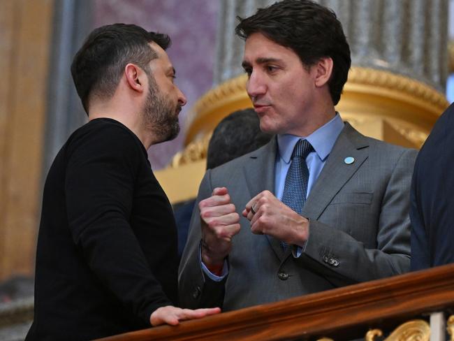 LONDON, ENGLAND - MARCH 2: Ukrainian President Volodymyr Zelensky (L) and Canadian Prime Minister Justin Trudeau (R) speak on the stairs on their way to a plenary meeting at a summit held at Lancaster House on March 2, 2025 in London, England. Following this week's meetings between Keir Starmer, Emmanuel Macron, and US President Donald Trump, a meeting convenes in London with European leaders to discuss future peace in Ukraine. (Photo by Justin Tallis - WPA Pool/Getty Images)