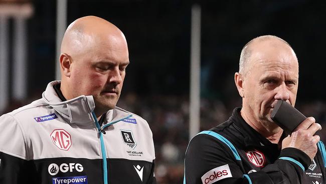 ADELAIDE, AUSTRALIA - APRIL 01: Ken Hinkley, Senior Coach of the Power walks off with General Manager of Football Chris Davies after the loss during the 2023 AFL Round 03 match between the Port Adelaide Power and the Adelaide Crows at Adelaide Oval on April 1, 2023 in Adelaide, Australia. (Photo by Sarah Reed/AFL Photos via Getty Images)