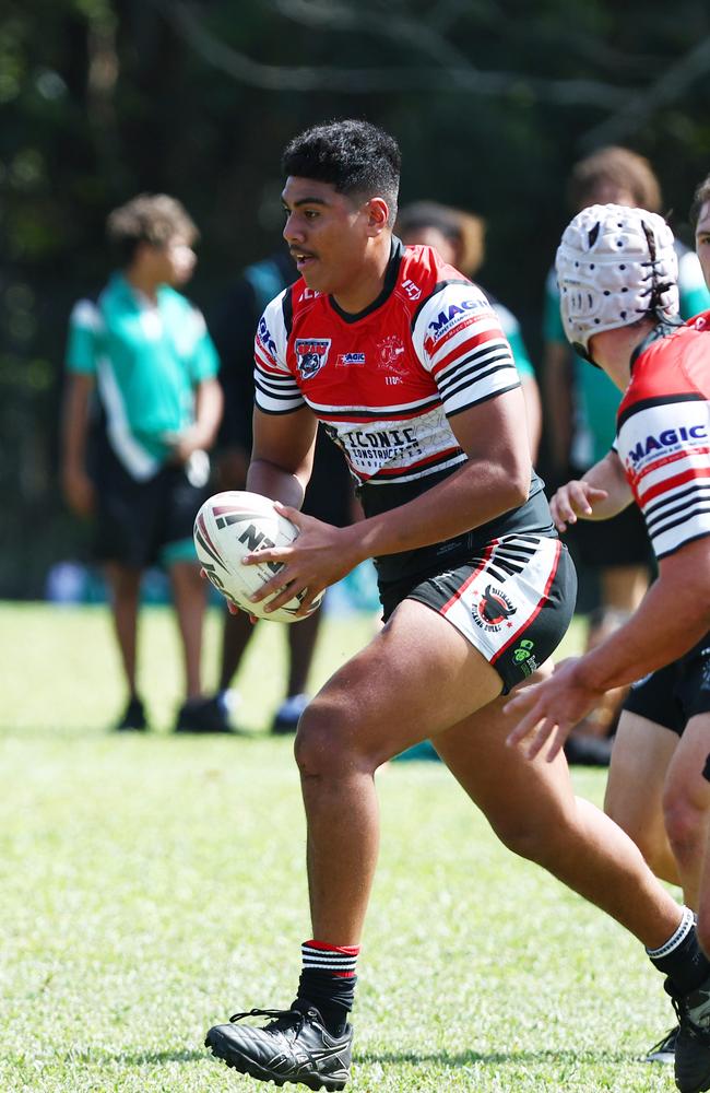 Kirwin's Quentin Ofahulu finds a gap in Trinity Bay's defence in the Aaron Payne Cup NRL Schoolboy's match between Kirwin State High School and Trinity Bay State High School. Picture: Brendan Radke